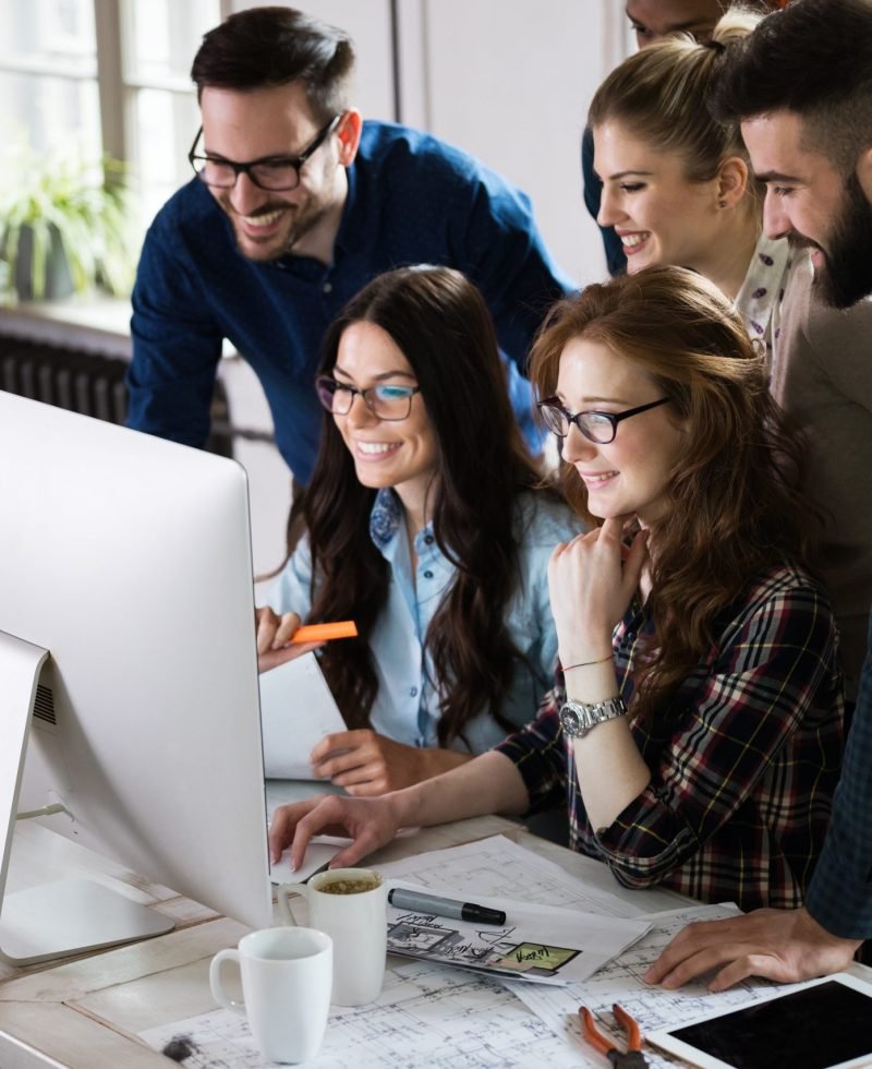 Young architects working on project in office together